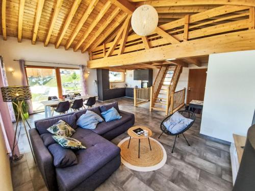 a living room with a couch and a table at Chalet Alpina by Interhome in Ovronnaz
