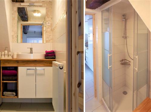 a bathroom with a sink and a shower at Ferienwohnung Die Schmiede in Schopfloch