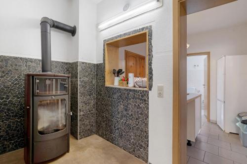 a kitchen with a stove in the corner of a room at Haus Berlin Annaberg in Annaberg-Buchholz