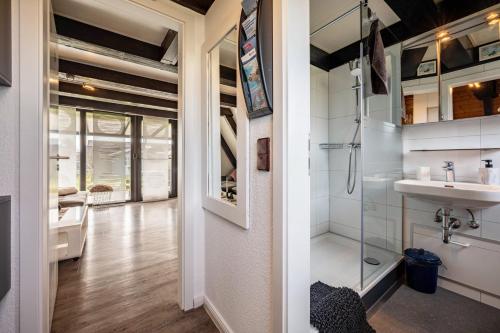a bathroom with a sink and a shower at Sonnenschein Am Meer in Butjadingen