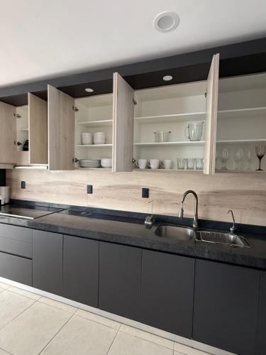 a kitchen with a sink and a counter top at Casaaurea in Jesús María