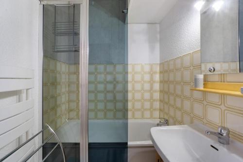a bathroom with a shower and a sink at Les Airelles 32 in Villarodin-Bourget