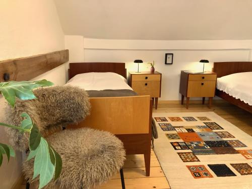 a bedroom with two beds and a stuffed animal at Gästehaus Schlamau19 in Schlamau