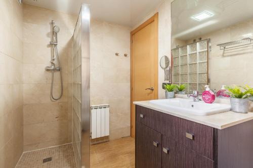 a bathroom with a sink and a shower at Casa Lourdes in Canyelles