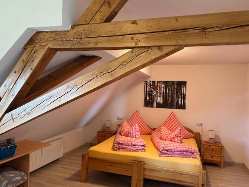 a bedroom with a bed with two pillows on it at Haus Jehle in Görwihl