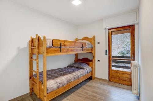 a bedroom with two bunk beds in a house at Casa Gianpaolo in Piode