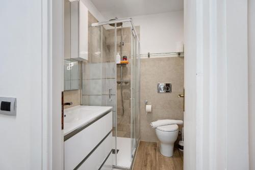 a bathroom with a shower and a toilet and a sink at Casa Gianpaolo in Piode