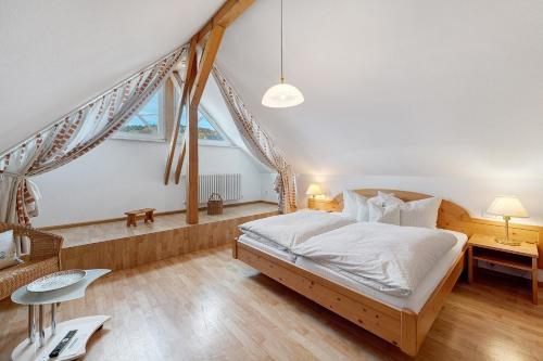 a bedroom with a bed and a desk and a window at Pension Deutscher Hof in Oberbiederbach