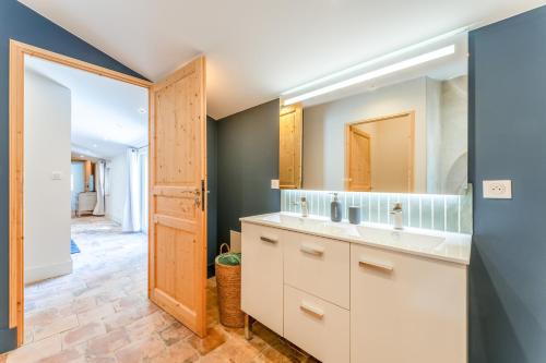 a bathroom with a sink and a mirror at Mas Saint Louis in Avignon