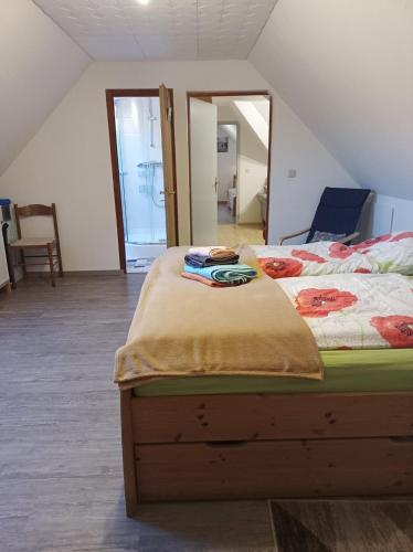 a bedroom with two beds and a large mirror at Ferienwohnung Schiemann in Krienke