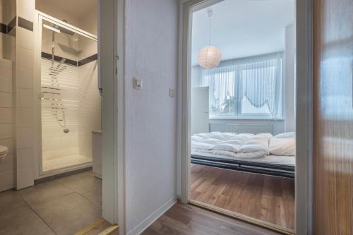 a reflection of a bed in a room with a mirror at Braunlageblick in Braunlage