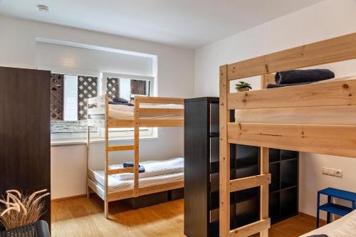 a room with two bunk beds and a ladder at Ferienwohnung Brandbergblick in Mayrhofen