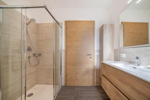 a bathroom with a shower and a sink at City Apartment Flora in Merano