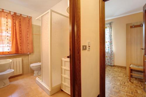 a bathroom with a toilet and a sink at Casa D'Agostino in Aosta