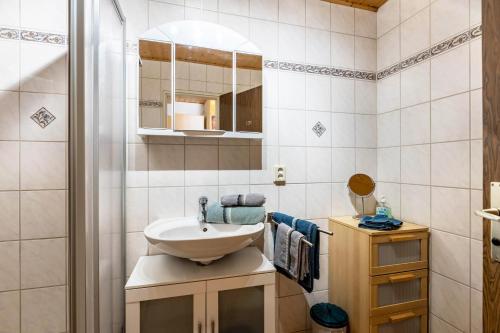 a bathroom with a sink and a mirror at Lorenz in Triberg