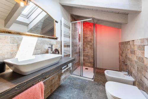 a bathroom with a sink and a shower at Abaye 5 Barolo - Charm Adults Only in Soiano del Lago