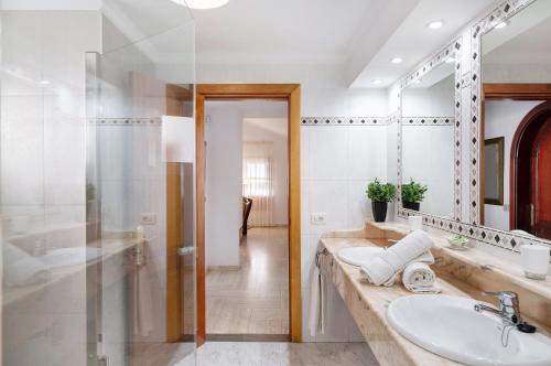 a bathroom with a sink and a mirror at Villa Muñoz in Puerto del Carmen