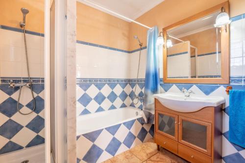 a bathroom with a sink and a tub and a shower at Ses Comes de Son Cladera in Manacor