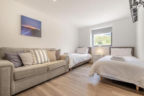 a living room with a couch and two beds at 2 Bed in Tintagel oc-m37507 in Tintagel
