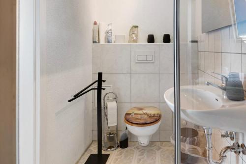 a bathroom with a toilet and a sink at Ferienwohnung Birgit in Dessau