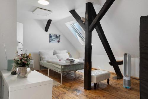 a living room with a couch and a window at Ferienwohnung Birgit in Dessau