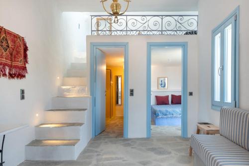 a hallway with stairs leading to a bedroom at Sylvia's Home in Sifnos