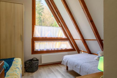 a small bedroom with a window and a bed at Gite Riesling n°5 à Kaysersberg in Kaysersberg