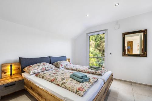 a bedroom with a bed and a window at Haus mit 4 Schlafzimmern in Solingen