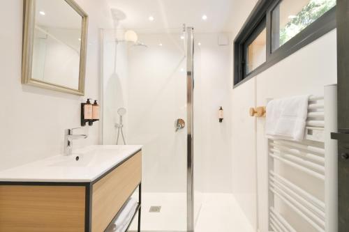 a bathroom with a shower and a sink at Chalet avec Piscine La Plagne in La Plagne Tarentaise