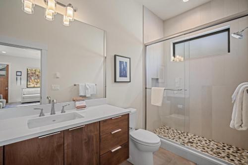 a bathroom with a toilet and a sink and a shower at 18221-2 Forestbrook Loop in Sunriver