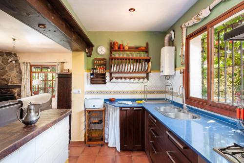 a kitchen with a sink and a counter top at Casa Balcón - Sólo Familias in Los Caños de Meca