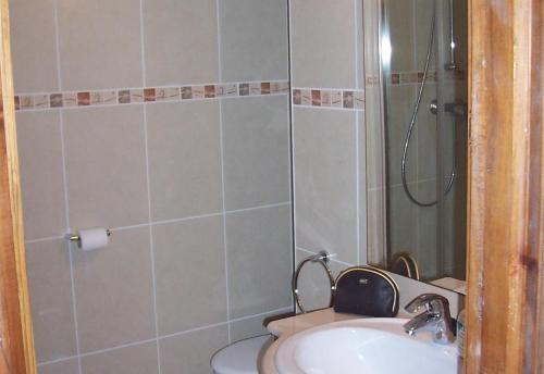 a bathroom with a shower and a sink at El Castillito in Begur