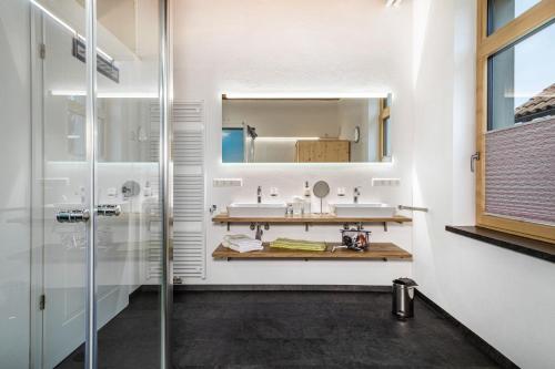 a bathroom with a sink and a mirror at Käserei in Argenbühl