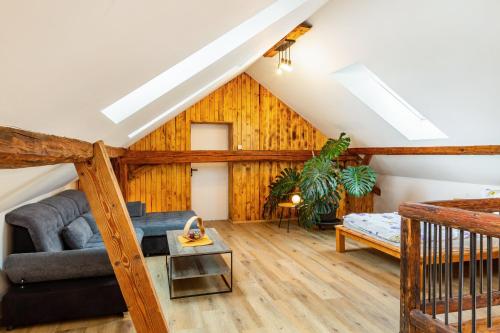 a living room with a couch and a table at Ameisberger - Landhaus in Mollmannsreith