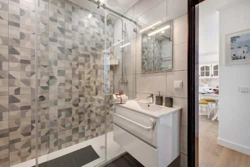 a bathroom with a sink and a shower at Dreamalvor in Alvor