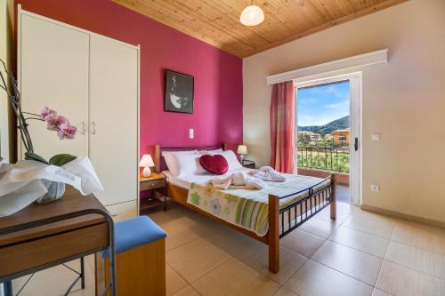 a bedroom with a bed and a window at Apartment Iole in Póndi