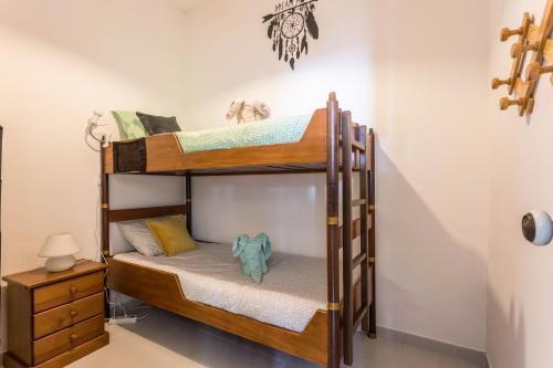 a couple of bunk beds in a room at Geo House in Vila do Bispo