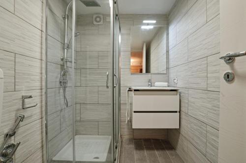 a bathroom with a shower and a sink at Villa Grazia in Manerba del Garda