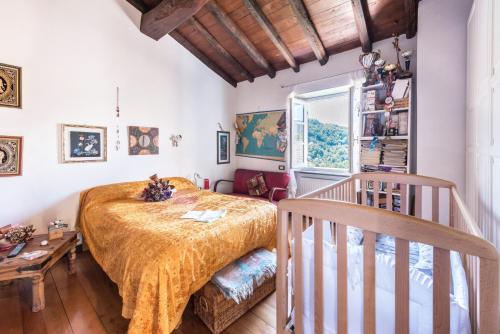 a bedroom with a large bed and a staircase at Ca dei gruppi in Cicagna