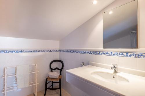 a bathroom with a sink and a mirror at Soller beach apartment in Sóller