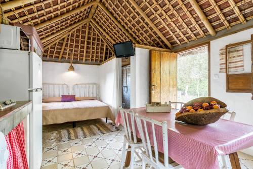a room with a table with a bowl of fruit on it at Casa La Castañuela in El Palmar