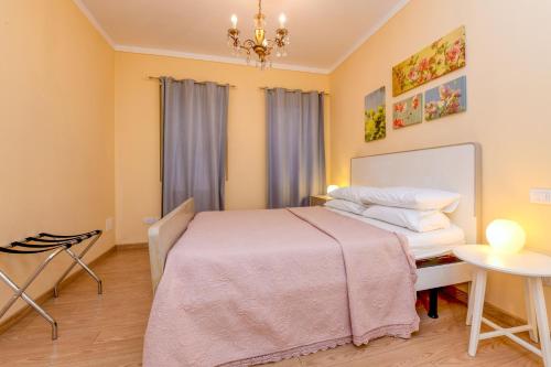a bedroom with a bed and a table at Colleincanto Appartamento Lina in Gavardo