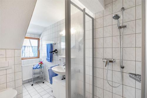 a bathroom with a shower and a sink at Ferienhof Siber in Owingen