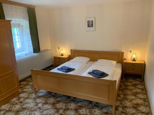 a bedroom with a large bed with two night stands at Ferienwohnung Durst 2 in Mayrhofen