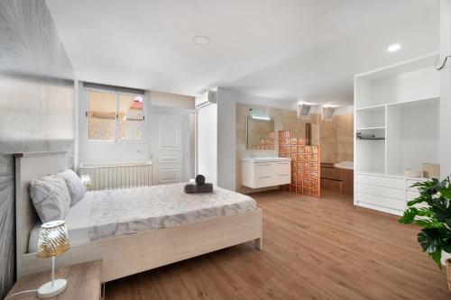 a large room with a bed and a bathroom at Beach Holidays in Adeje