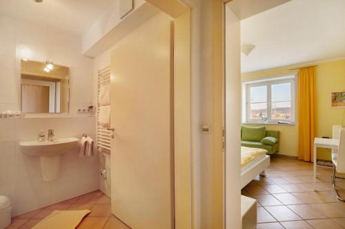 a bathroom with a sink and a toilet at Birkethof Studio in Mickhausen