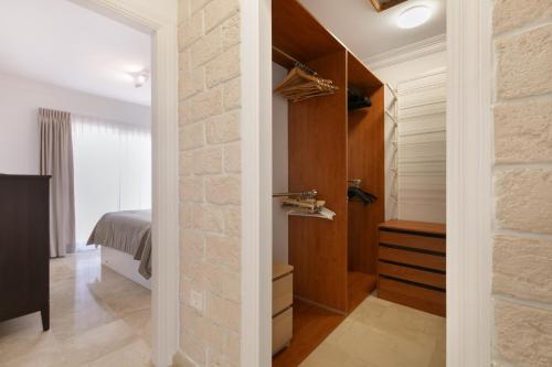 a room with a brick wall and a bedroom at Private Villa Candelaria in Candelaria