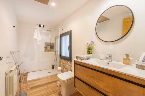 a bathroom with a sink and a mirror at Cantó el Sech in Montoliu de Segarra