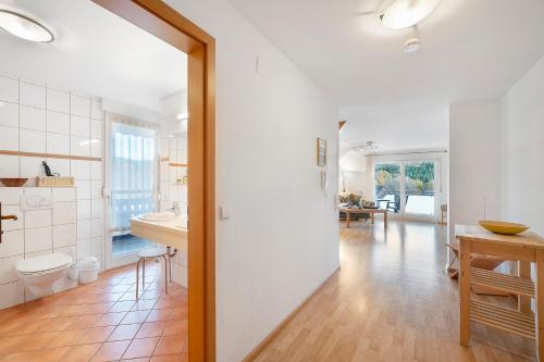 a bathroom with a sink and a toilet in a room at Pension Deutscher Hof in Oberbiederbach