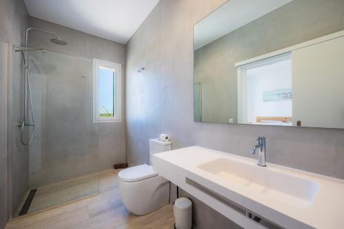 a bathroom with a sink and a toilet and a mirror at Son Crespi Vell 2 in Manacor